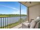 Relaxing outdoor balcony with chairs and a scenic water view at 17626 Gawthrop Dr # 305, Bradenton, FL 34211