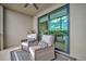 Relax on this balcony with comfortable seating, offering a glimpse of the inviting interior at 17626 Gawthrop Dr # 305, Bradenton, FL 34211