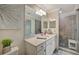 Bright bathroom featuring a single sink vanity, marble countertop and walk-in shower at 17626 Gawthrop Dr # 305, Bradenton, FL 34211