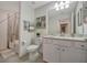 Bright bathroom featuring a single sink vanity, marble countertop and shower over tub combo at 17626 Gawthrop Dr # 305, Bradenton, FL 34211