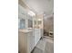 Bright bathroom featuring a single sink vanity, marble countertop and walk-in shower at 17626 Gawthrop Dr # 305, Bradenton, FL 34211
