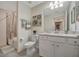 Bright bathroom featuring a single sink vanity, marble countertop and shower over tub combo at 17626 Gawthrop Dr # 305, Bradenton, FL 34211