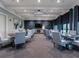 Community dining area with several tables and chairs, modern lighting, and contemporary design at 17626 Gawthrop Dr # 305, Bradenton, FL 34211