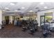 Community fitness center with multiple machines and patterned flooring at 17626 Gawthrop Dr # 305, Bradenton, FL 34211