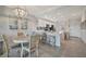 Bright kitchen featuring stainless steel appliances, white cabinets, and a dining area at 17626 Gawthrop Dr # 305, Bradenton, FL 34211