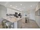 Bright kitchen featuring modern appliances, white cabinets, and a large island at 17626 Gawthrop Dr # 305, Bradenton, FL 34211
