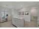 Bright kitchen features a center island with quartz countertop, modern cabinetry, and stainless steel appliances at 17626 Gawthrop Dr # 305, Bradenton, FL 34211