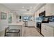 Bright kitchen featuring modern appliances, white cabinets, and a large island at 17626 Gawthrop Dr # 305, Bradenton, FL 34211