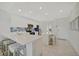 Modern kitchen featuring stainless steel appliances, white cabinetry, a center island and an eat-in area at 17626 Gawthrop Dr # 305, Bradenton, FL 34211