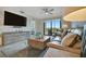 Comfortable living room with plush seating, modern decor, and a sliding glass door to the outside at 17626 Gawthrop Dr # 305, Bradenton, FL 34211