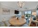 Open concept living space featuring a view of the large balcony, fan and comfortable seating at 17626 Gawthrop Dr # 305, Bradenton, FL 34211