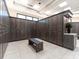 Clean and organized locker room features ample storage, a bench, and neutral decor for a comfortable experience at 17626 Gawthrop Dr # 305, Bradenton, FL 34211
