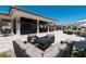 Inviting outdoor seating area features a fire pit, comfortable lounge chairs, and nearby outdoor bar area at 17626 Gawthrop Dr # 305, Bradenton, FL 34211