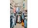 Well-organized walk-in closet with hanging racks, shelves, and storage bins for optimal organization at 17626 Gawthrop Dr # 305, Bradenton, FL 34211