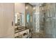 Modern bathroom with glass-enclosed shower, decorative tile, and stylish vanity at 1771 Ringling Blvd # 1212, Sarasota, FL 34236