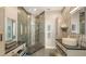 Modern bathroom with glass-enclosed shower, decorative tile, and stylish vanity at 1771 Ringling Blvd # 1212, Sarasota, FL 34236