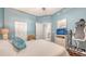 Bright bedroom featuring calming blue walls and a comfy bed with stylish throw pillow at 1771 Ringling Blvd # 1212, Sarasota, FL 34236