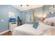 Comfortable bedroom with hardwood floors, shuttered windows, and TV at 1771 Ringling Blvd # 1212, Sarasota, FL 34236