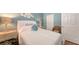 Cozy bedroom with a queen bed featuring a white bedspread and decorative pillows at 1771 Ringling Blvd # 1212, Sarasota, FL 34236