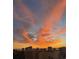 A captivating city view with a stunning orange and pink sunset, enhancing the urban landscape at 1771 Ringling Blvd # 1212, Sarasota, FL 34236