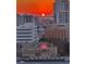 Scenic cityscape with a fiery sunset painting the sky, buildings, and distant horizon in warm hues at 1771 Ringling Blvd # 1212, Sarasota, FL 34236