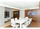 Conference room showcases a large table, white leather chairs, and views into the lounge at 1771 Ringling Blvd # 1212, Sarasota, FL 34236