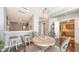 Dining area with barstool seating looking into the kitchen and view of living spaces at 1771 Ringling Blvd # 1212, Sarasota, FL 34236