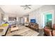 Contemporary living room boasting stylish decor, hardwood floors, and a glimpse into the modern dining area at 1771 Ringling Blvd # 1212, Sarasota, FL 34236