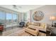 Bright living room featuring a large window, artwork, and comfortable seating arrangements at 1771 Ringling Blvd # 1212, Sarasota, FL 34236