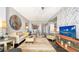 Bright and modern living room with hardwood floors, stylish furniture, and an open view to the dining area at 1771 Ringling Blvd # 1212, Sarasota, FL 34236