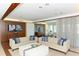 Sophisticated living room features two plush sofas, stylish wood accents, and elegant decor at 1771 Ringling Blvd # 1212, Sarasota, FL 34236