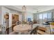 Open-concept living area featuring stylish furniture, dark wood floors, and city views at 1771 Ringling Blvd # 1212, Sarasota, FL 34236