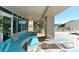Relaxing patio with outdoor seating, comfortable cushions, and poolside access offers luxury living at 1771 Ringling Blvd # 1212, Sarasota, FL 34236