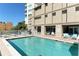 Inviting pool area features a spa, high-rise views, and lounge chairs for ultimate relaxation at 1771 Ringling Blvd # 1212, Sarasota, FL 34236