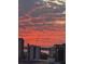 Beautiful sunset view over the city, casting a vibrant orange and pink glow across the sky and buildings at 1771 Ringling Blvd # 1212, Sarasota, FL 34236
