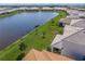 Scenic aerial view of the lake and community, showcasing the home's prime location at 17966 Grand Prosperity Dr, Venice, FL 34293