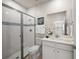 Elegant bathroom with tiled shower, vanity with quartz countertop and modern fixtures at 17966 Grand Prosperity Dr, Venice, FL 34293