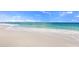 Beautiful beach with crystal-clear water and pristine white sand at 17966 Grand Prosperity Dr, Venice, FL 34293