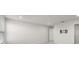 A spacious bedroom with a blank wall and closet and door entrances to other rooms at 17966 Grand Prosperity Dr, Venice, FL 34293