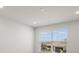 Bright and airy bedroom with neutral walls, recessed lighting, and a window at 17966 Grand Prosperity Dr, Venice, FL 34293