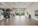 Bright fitness center with various weights and machines, complete with ceiling fans and mirrored walls at 17966 Grand Prosperity Dr, Venice, FL 34293