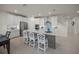Spacious kitchen featuring a large center island, stainless steel appliances, and stylish white cabinets at 17966 Grand Prosperity Dr, Venice, FL 34293