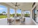 Outdoor seating area with comfortable chairs arranged around a central fire pit, perfect for gatherings at 17966 Grand Prosperity Dr, Venice, FL 34293