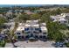 Aerial view of a multi-Gathering unit with beach, golf course, and trees in the background at 1912 Harbourside Dr # 602, Longboat Key, FL 34228