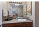 Bathroom features a mirror, decor, and a sink with a view to the bedroom at 1912 Harbourside Dr # 602, Longboat Key, FL 34228