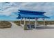 Beach cabana with picnic table offers a shaded spot with ocean views at 1912 Harbourside Dr # 602, Longboat Key, FL 34228
