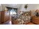 Bedroom with tropical bedding, wood furniture, and a bright window at 1912 Harbourside Dr # 602, Longboat Key, FL 34228