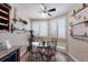 Bright breakfast nook with large windows, plantation shutters, and coastal-themed decor at 1912 Harbourside Dr # 602, Longboat Key, FL 34228