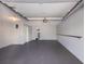 Clean, empty garage with painted floor and walls, includes entry door to living space at 1912 Harbourside Dr # 602, Longboat Key, FL 34228