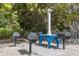 Outdoor grilling station with multiple grills surrounded by lush greenery at 1912 Harbourside Dr # 602, Longboat Key, FL 34228